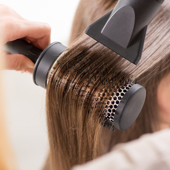 stock-photo-drying-long-brown-hair-with-hair-dryer-and-round-brush-close-up-197226602